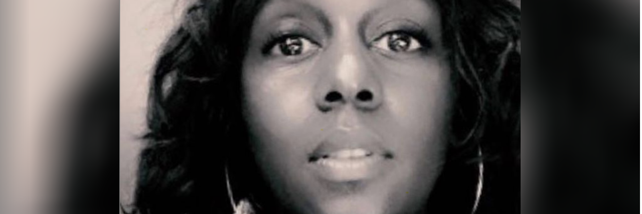 Cur8able Site Curates Adaptive Fashion for People With Disabilities A black and white selfie of Stephanie Thomas, with long brown hair and gold earrings