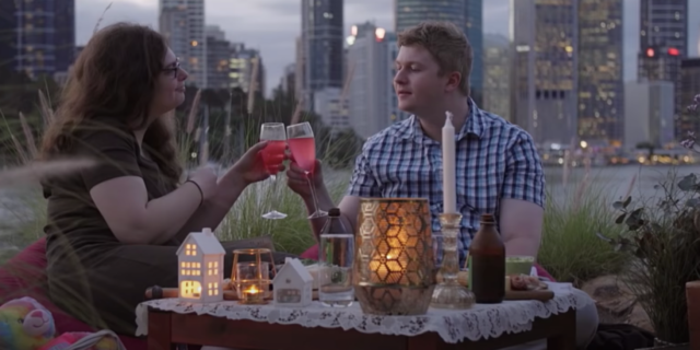 What I Loved About 'Love on the Spectrum' as Someone With Autism Two people on a date, with a city in the background