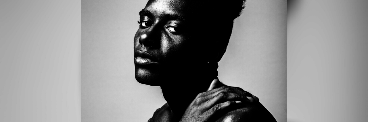 How the Church Can Address Their Part in the High LGBTQIA Suicide Rate photo of black man with hand on his bare shoulder, looking into camera with sadness