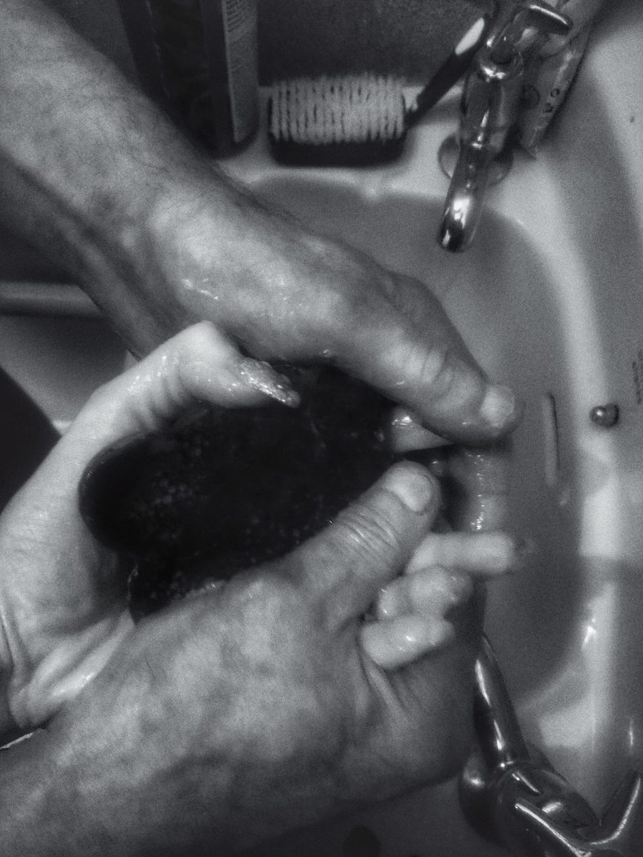 Wash Your Hands:black-and-white photo of Grace helping her father wash his hands.