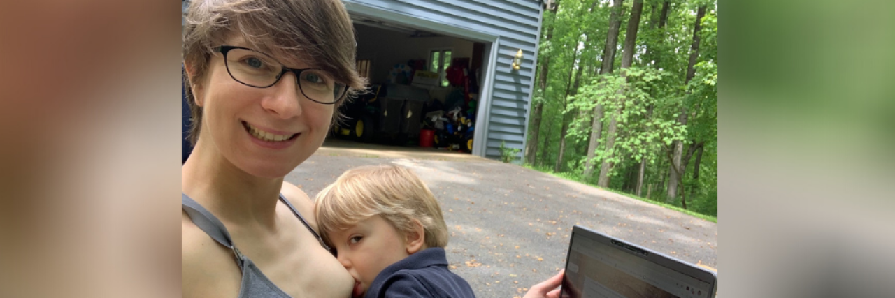 Choosing to Breastfeed Instead of Medicate for My Mental Health Mother smiles while nursing toddler