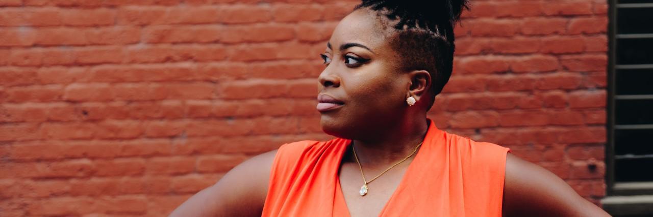 How the BMI Measure Is Racist, Sexist and Harming Black Women photo of woman with hands on her hips, looking away, with hands on her hips