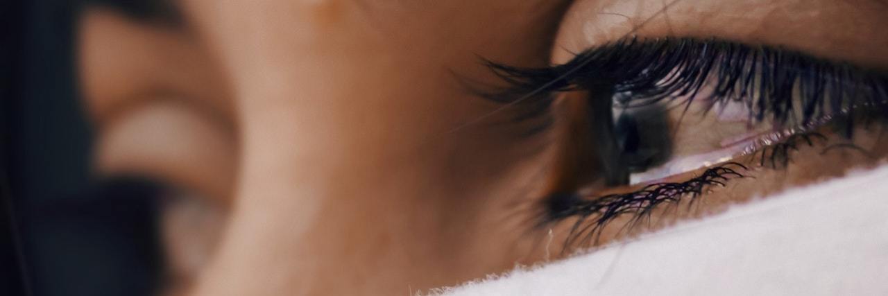 What to Remember When a Depressive Episode Starts close up of a woman's eyes, full of tears