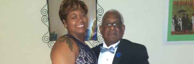 Jae Cobb in a long blue dress and her father, who's wearing a tux with a blue bowtie