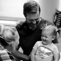 A family visiting their new baby in hospital