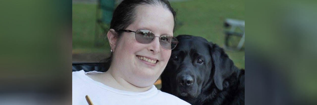 Miriam with her Labrador retriever service dog, Yahtzee.