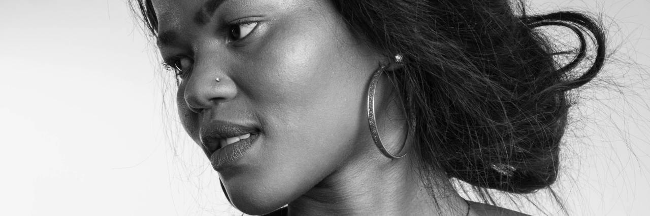 Can I Forgive My Childhood Abuser When Jessica Simpson Forgave Hers? black and white photo of Black woman looking down and away from camera