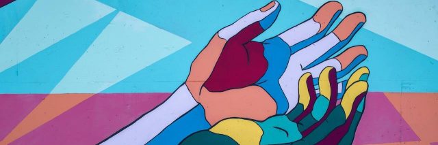 Multicolored illustration of two hands reaching out