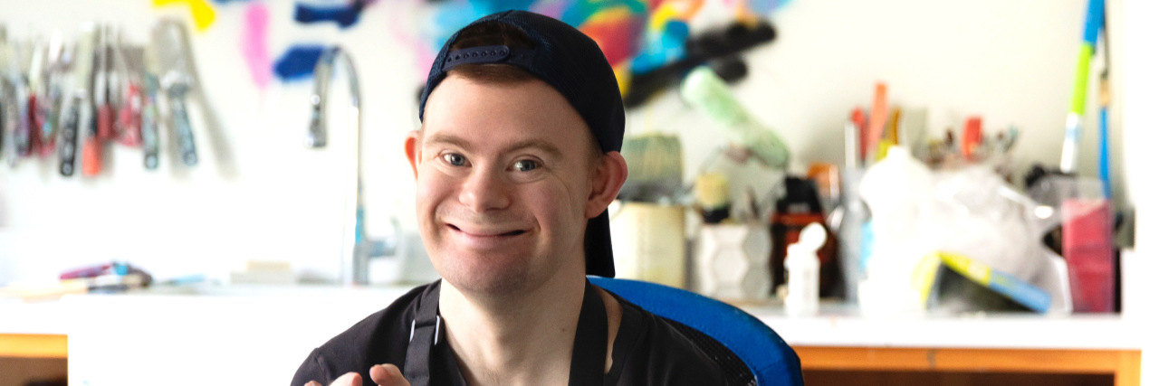 My Son With Down Syndrome, Charlie French, Found His Joy as an Artist Charlie French working on his art.