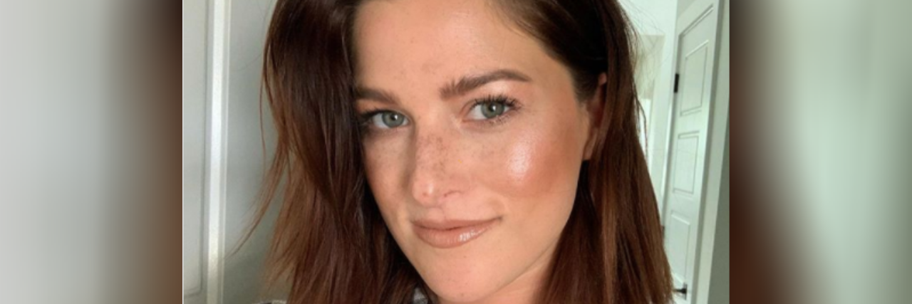Cassadee Pope Shares Impact of Childhood Trauma on Her Mental Health Selfie of Cassadee Pope, a woman with shoulder-length brown hair, wearing a black and white plaid shirt