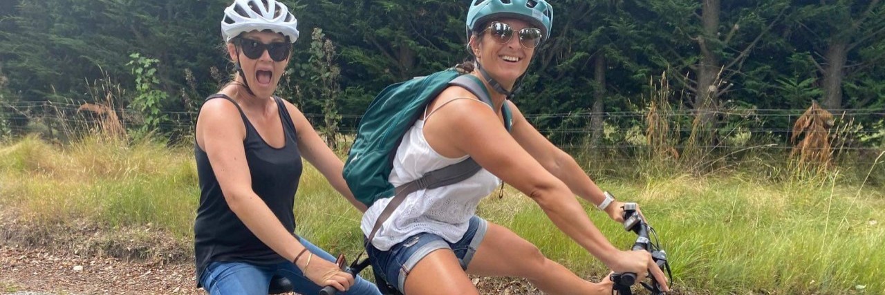 Navigating Friendships After Brain Injury 2 girls on a tandem bike