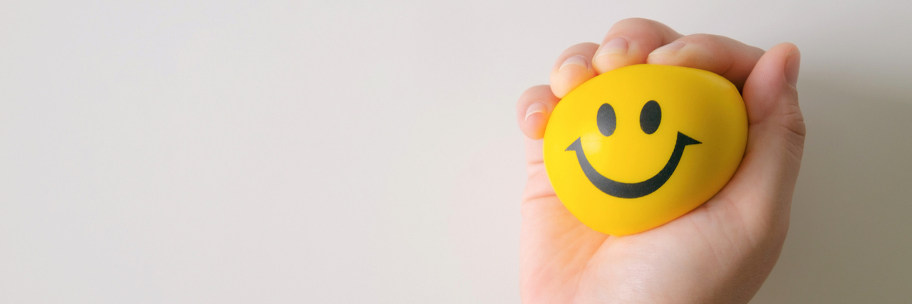15 Things to Do With Your Hands When You're Anxious Hand squeeze yellow stress ball to relax.