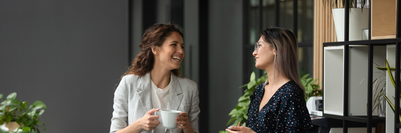 The Difference Between Autism Awareness and Acceptance Two friends talking.