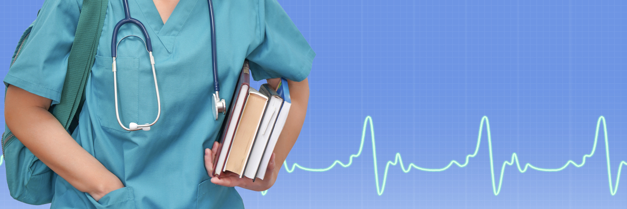 Female medical student carrying books.