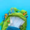 Backpack with school supplies and set of sanitizers and medical protective masks.