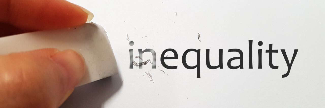 Why Fighting for Disability Rights Is So Important A hand erasing off part of the word inequality