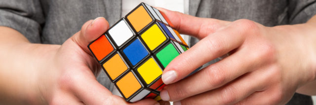 Person solving Rubik's cube.