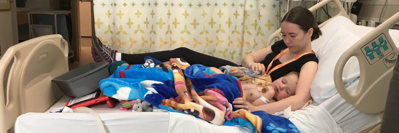 3 Things To Know Before Your Child Has Open-Heart Surgery a mom sitting with her toddler in a hospital bed