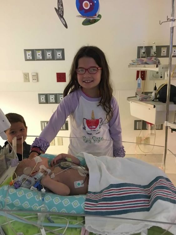 Erin's kids visiting their brother in the hospital.