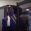 Dr. Quentin J. Lee peeks out from behind a school vending machine ready to spray a can of Lysol