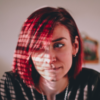 Woman with red hair biting her lip