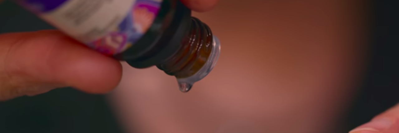 '(Un)Well' Review: Netflix Exposes the Wellness Industry Personal drips essential oil onto a paper strip