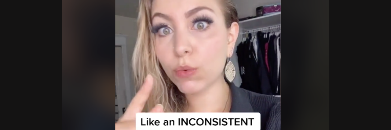 TikTok Explains Why Some People Stay in Abusive Relationships A woman talking on TikTok, the words "inconsistent reward" is on the screen