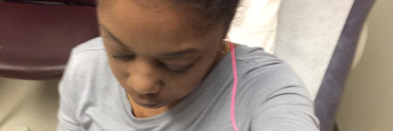 The Limits of Understanding a Loved One's Chronic Illness the author looking down at the doctor's