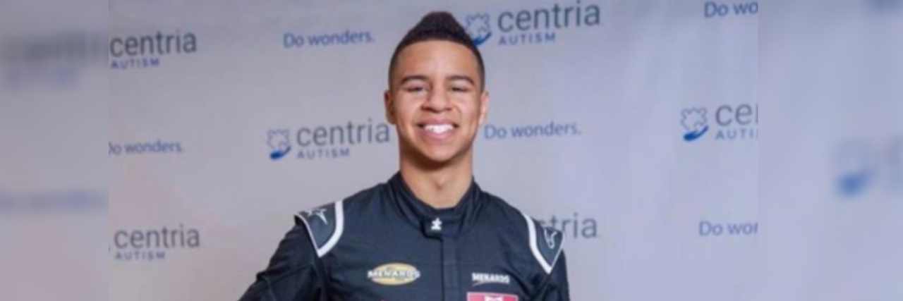 Armani Williams is the First Openly Autistic NASCAR Driver Armani Williams in a racers uniform at a Centria Autism event