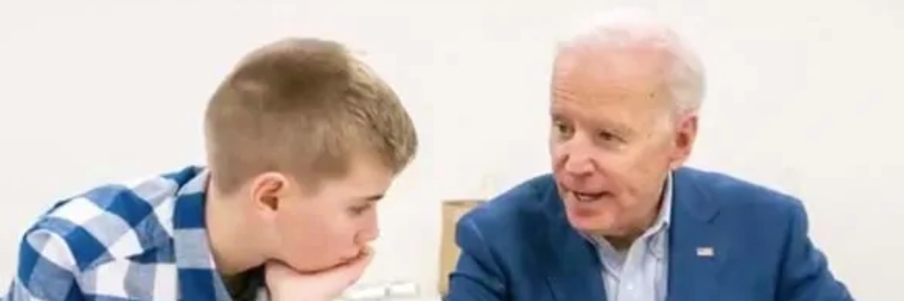 Teenager Describes How  Biden Helped Him Feel Confident About Stutter Joe Biden showing Braydon Harrington a book.