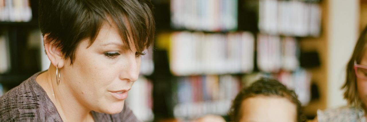 What Happened When I Told My Students About My Mental Illness A teacher reading a book to her student