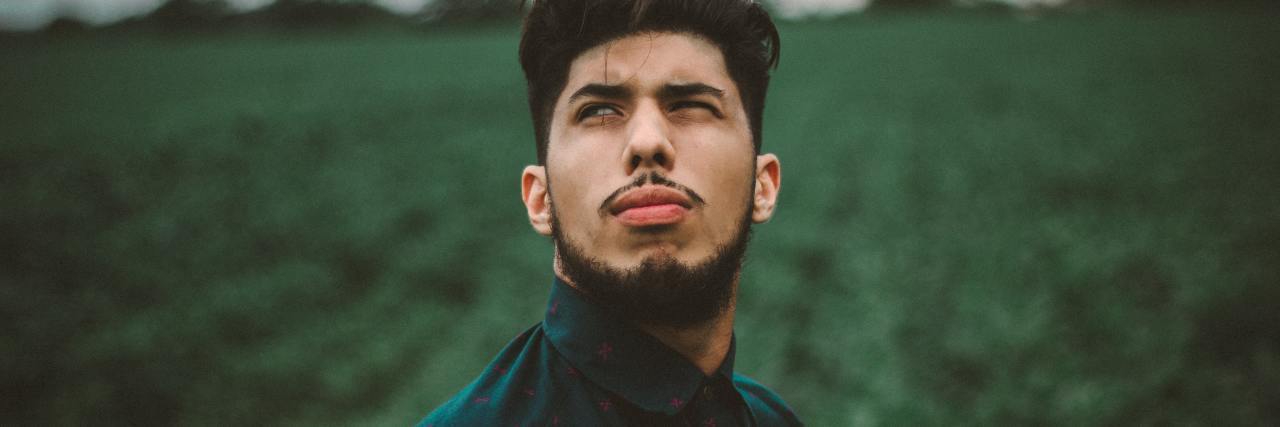 Depression Makes Me Feel Like a Failure An asian man standing outside, looking up