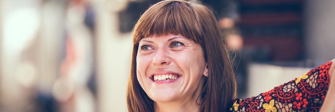 Taking Action Beyond Words and Setting Boundaries in Relationships Woman smiling and looking away from camera