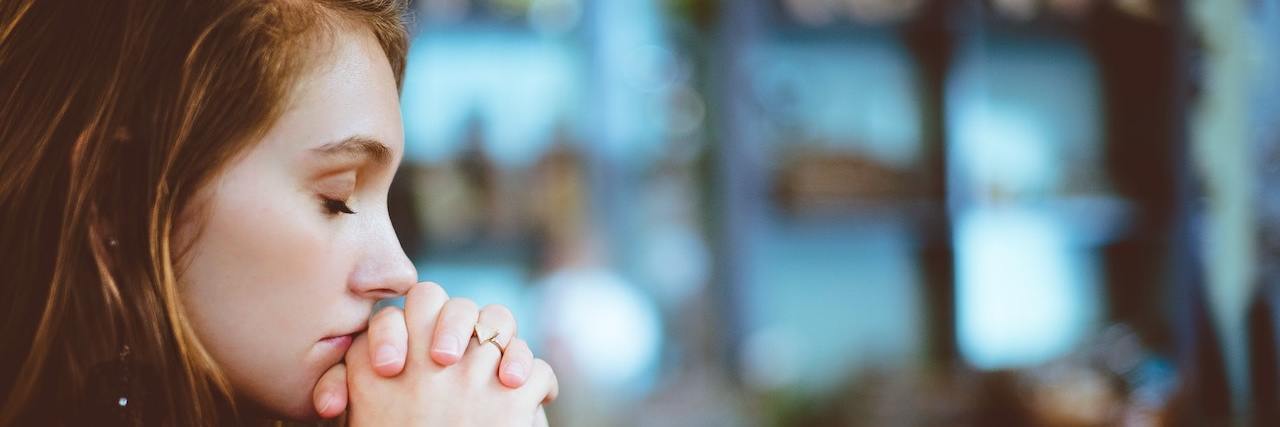 How Childhood Trauma Is Destroying My Faith Woman praying