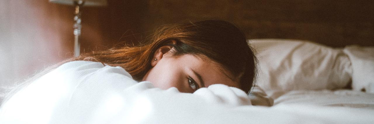 A woman lying in bed