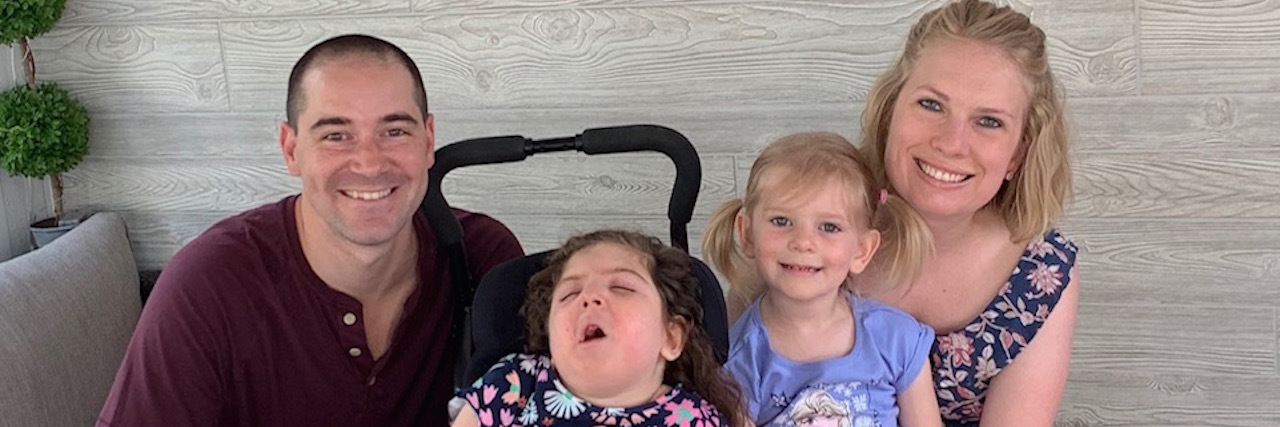 Managing Care for Medically Complex Children During Covid-19: Tips Sarah's family sitting together smiling in their home