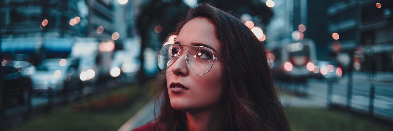 When Bipolar Depression Robs Me of Joy Woman wearing glasses outside in city