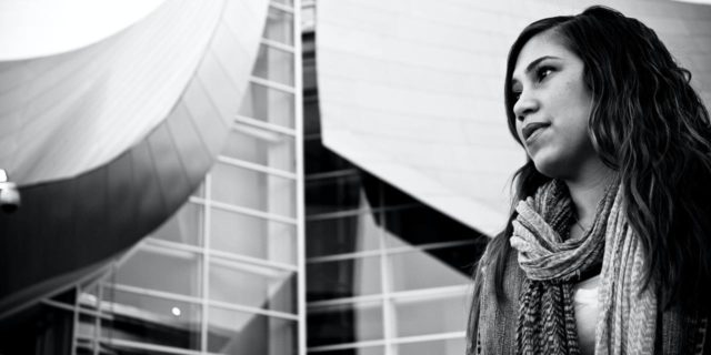 Why OCD Treatment Has to Change After the COVID-19 Pandemic black and white photo of woman looking concerned standing in front of glass buildings