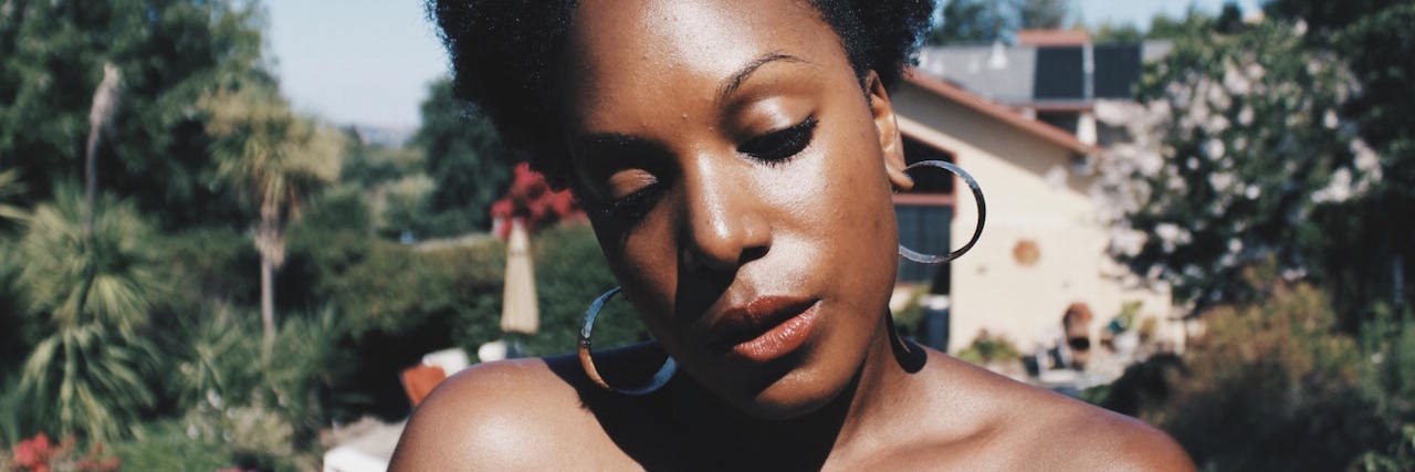 My Experience in Two Different Psychiatric Hospitals A woman standing outside