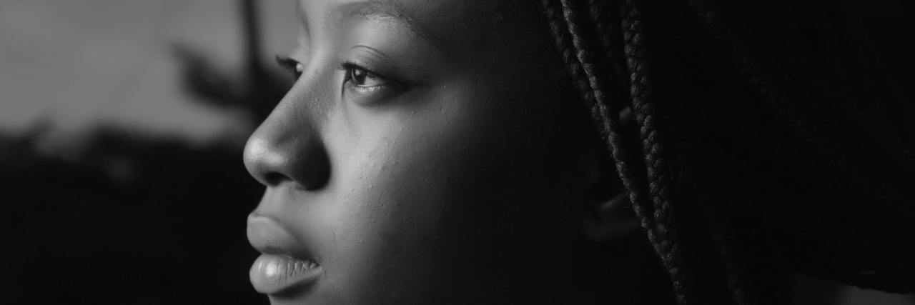 Explained: How Democrats Are Taking on Mental Health in 2020 Election black and white photo of woman in profile view looking to the left