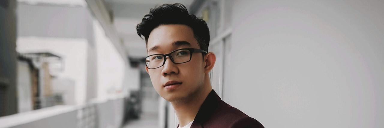 Believing Compliments Along With My Self-Worth Young man looking at camera