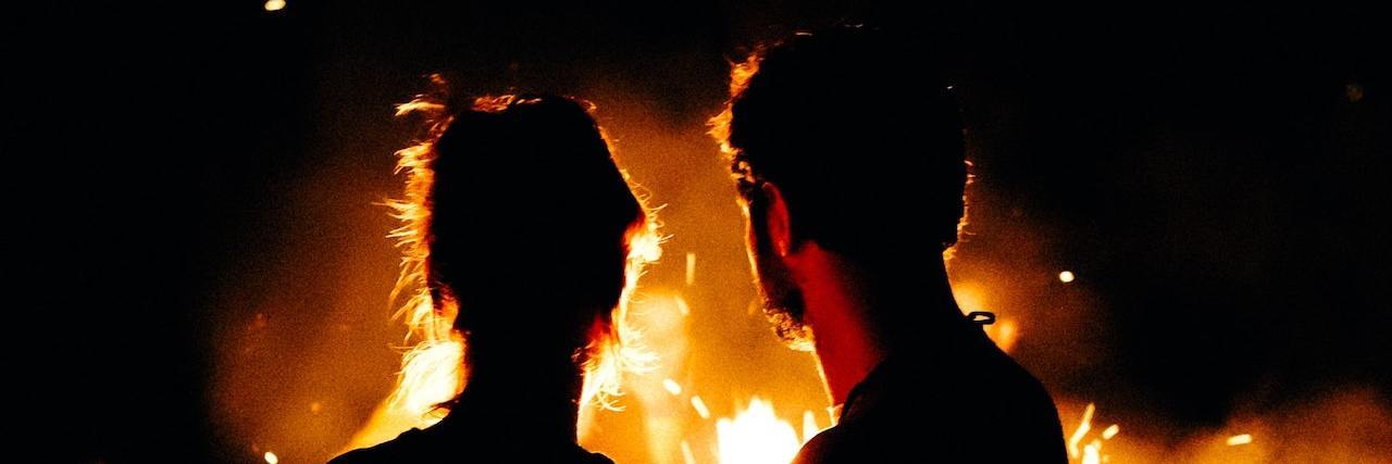 The Bipolar Disorder Delusion of Love: Clerambault's Syndrome Silhouette of man and woman in front of a fire