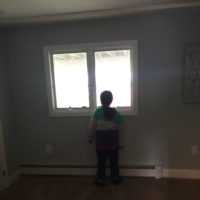 James' son looking out a window.
