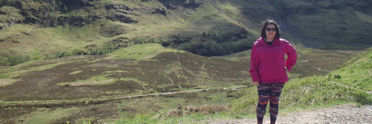 photo of the contributor standing in front of mountains