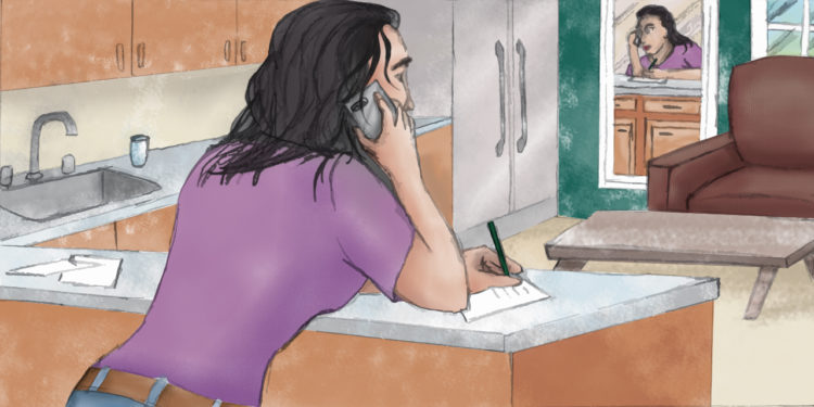 A female therapist leans over her kitchen counter with a cell phone pressed against her ear