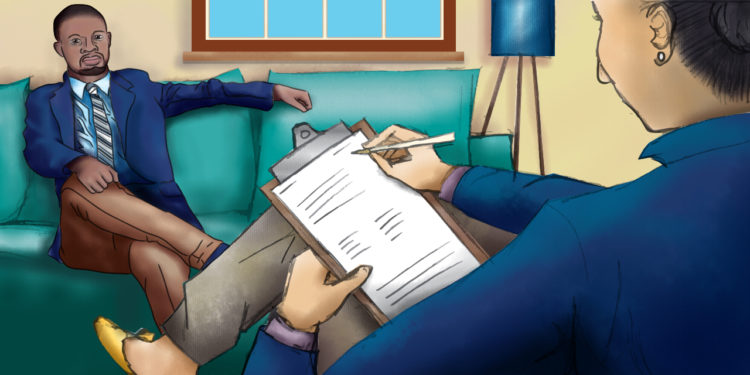 A female therapist wearing a blue blazer and taking notes on a clipboard sits across from a Black man on a teal couch in the therapy room