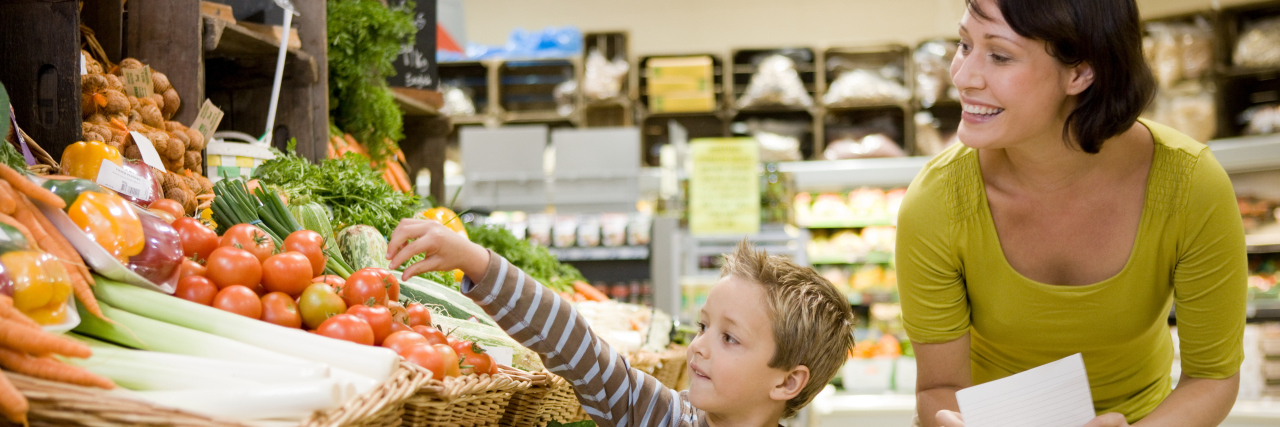 Why Labeling Autistic Kids 'High-Functioning' Is Harmful Mother and son in supermarket.