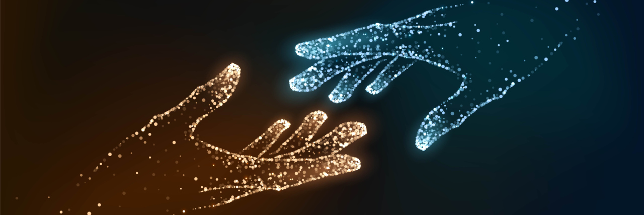 How to Practice Self-Care If You're an Empath Graphic of two hands of glowing orange and blue reaching toward each other