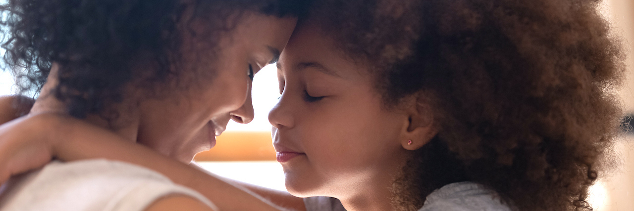 Parenting Kids With Disabilities and Preventing Burn Out A mother and daughter looking to each other