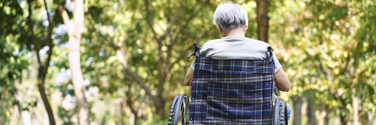 How the Pandemic Has Affected the Dementia and Alzheimer's Community an older man sitting alone in a wheelchair